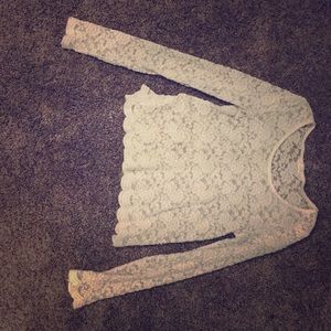 A white crop top with flower designs.